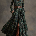 Woman wearing a belted plaid shirt dress with structured collar and flared skirt