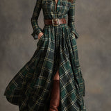 Woman wearing a belted plaid shirt dress with structured collar and flared skirt