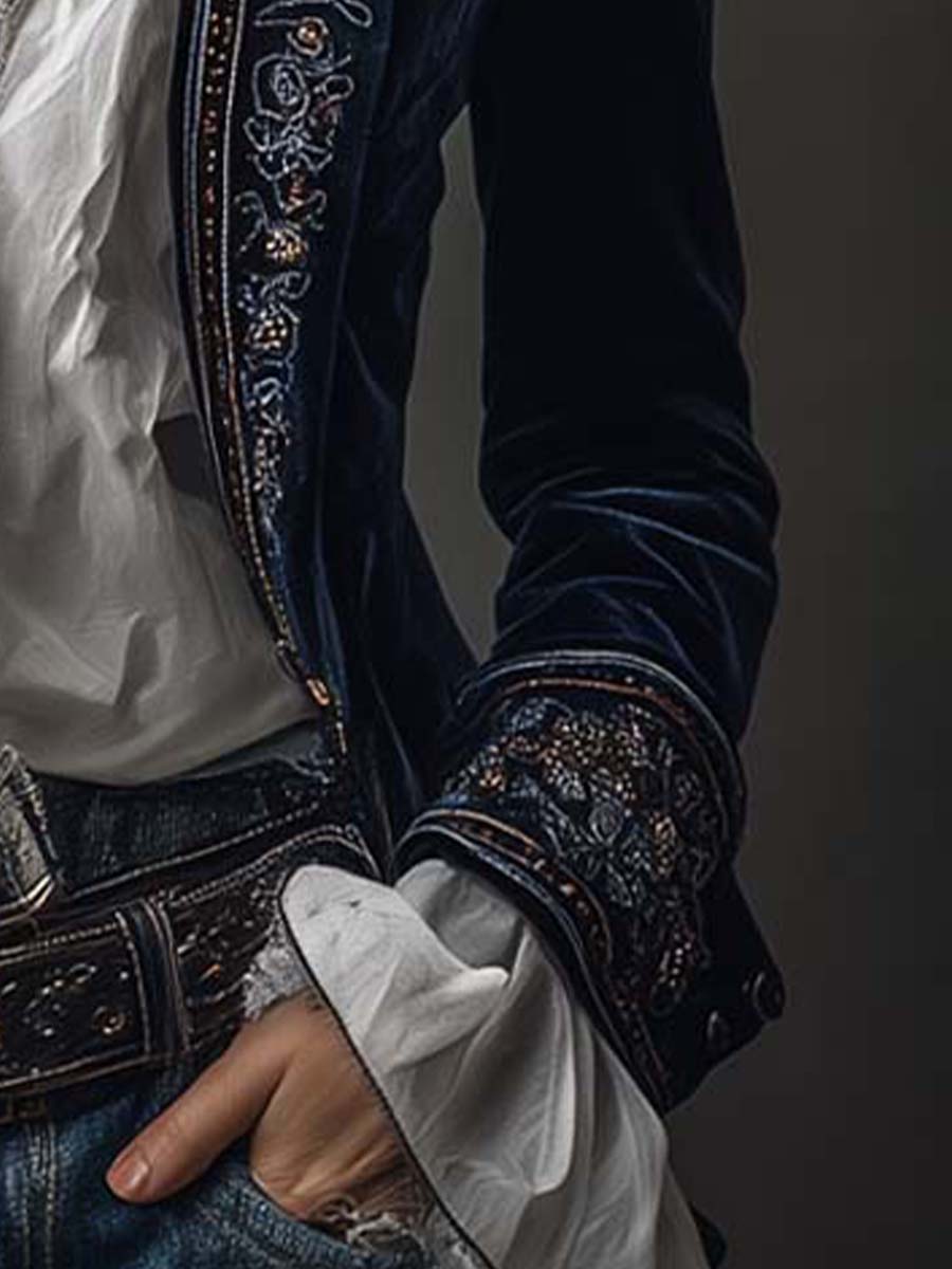 Woman wearing a long embroidered velvet jacket
