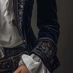 Woman wearing a long embroidered velvet jacket