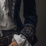 Woman wearing a long embroidered velvet jacket
