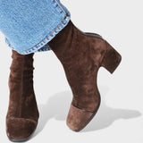 Margot slouchy suede block-heel ankle boots in brown - heel and profile detail