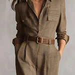 Woman wearing a tailored check jumpsuit with belt