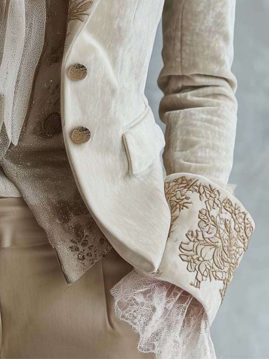 Woman wearing an ivory embroidered blazer