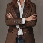 Woman wearing a herringbone panel blazer