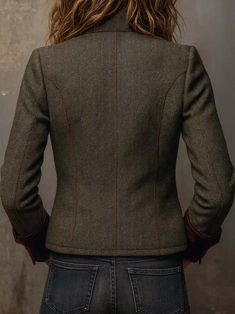 Woman wearing a herringbone blazer with contrast trim
