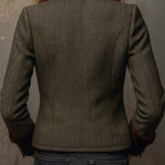 Woman wearing a herringbone blazer with contrast trim