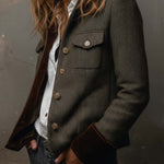 Woman wearing a herringbone blazer with contrast trim