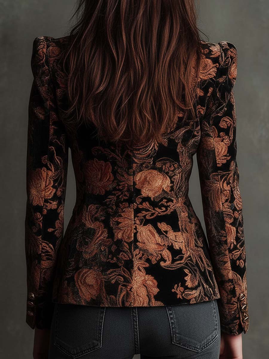 Woman wearing a black and bronze floral blazer
