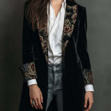 Woman wearing a long slim baroque print blazer