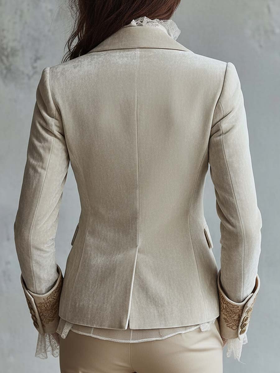Woman wearing an ivory embroidered blazer