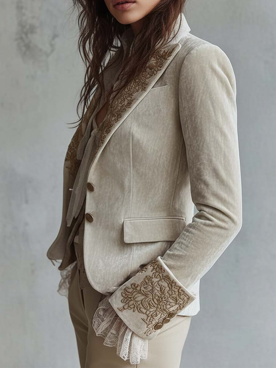Woman wearing an ivory embroidered blazer