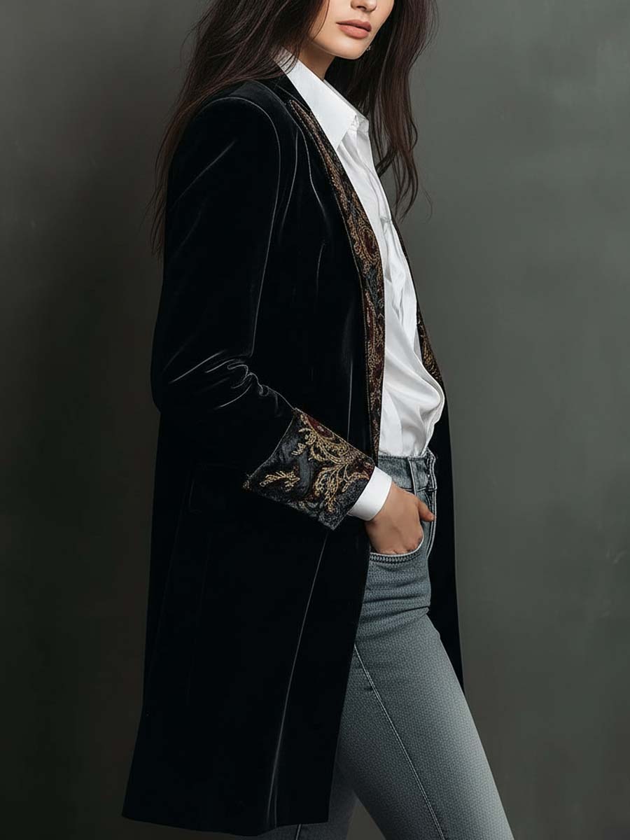 Woman wearing a long slim baroque print blazer
