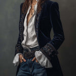 Woman wearing a long embroidered velvet jacket