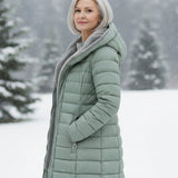 Woman wearing a fleece-lined quilted padded jacket with a shaped waist