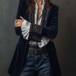 Woman wearing a long embroidered velvet jacket
