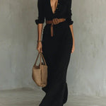 Woman wearing a wrap-style maxi dress with belt
