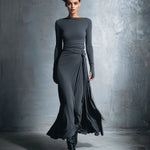Woman wearing a long-sleeve maxi dress with an adjustable side tie