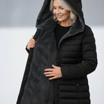 Woman wearing a fleece-lined quilted padded jacket with a shaped waist