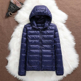 Navy blue lightweight padded jacket with a feminine fit