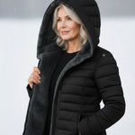 Woman wearing a fleece-lined quilted padded jacket with a shaped waist
