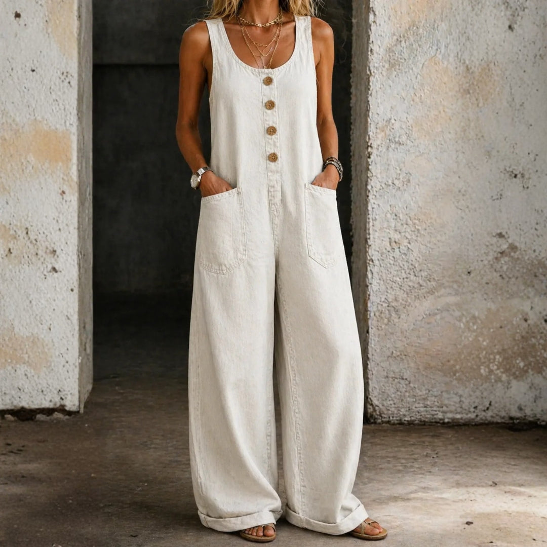 Woman wearing a sleeveless vintage-style cotton jumpsuit with square neckline