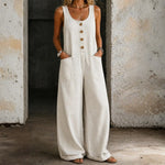 Woman wearing a sleeveless vintage-style cotton jumpsuit with square neckline