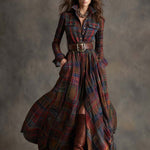 Woman wearing a belted plaid shirt dress with structured collar and flared skirt