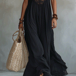 Woman in a draped sleeveless ankle-length maxi dress