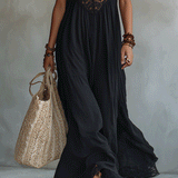 Woman in a draped sleeveless ankle-length maxi dress
