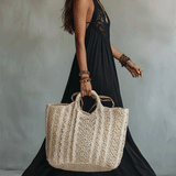 Woman in a draped sleeveless ankle-length maxi dress