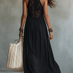 Woman in a draped sleeveless ankle-length maxi dress
