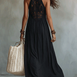 Woman in a draped sleeveless ankle-length maxi dress