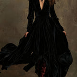 Woman wearing a deep V-neck pleated maxi dress