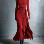 Woman wearing a long-sleeve maxi dress with an adjustable side tie