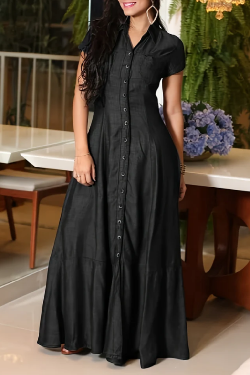 Woman wearing a long shirt-style denim dress