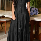Woman wearing a long shirt-style denim dress