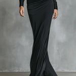 Woman wearing a satin ruched mermaid dress