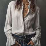 Woman wearing a long embroidered velvet jacket