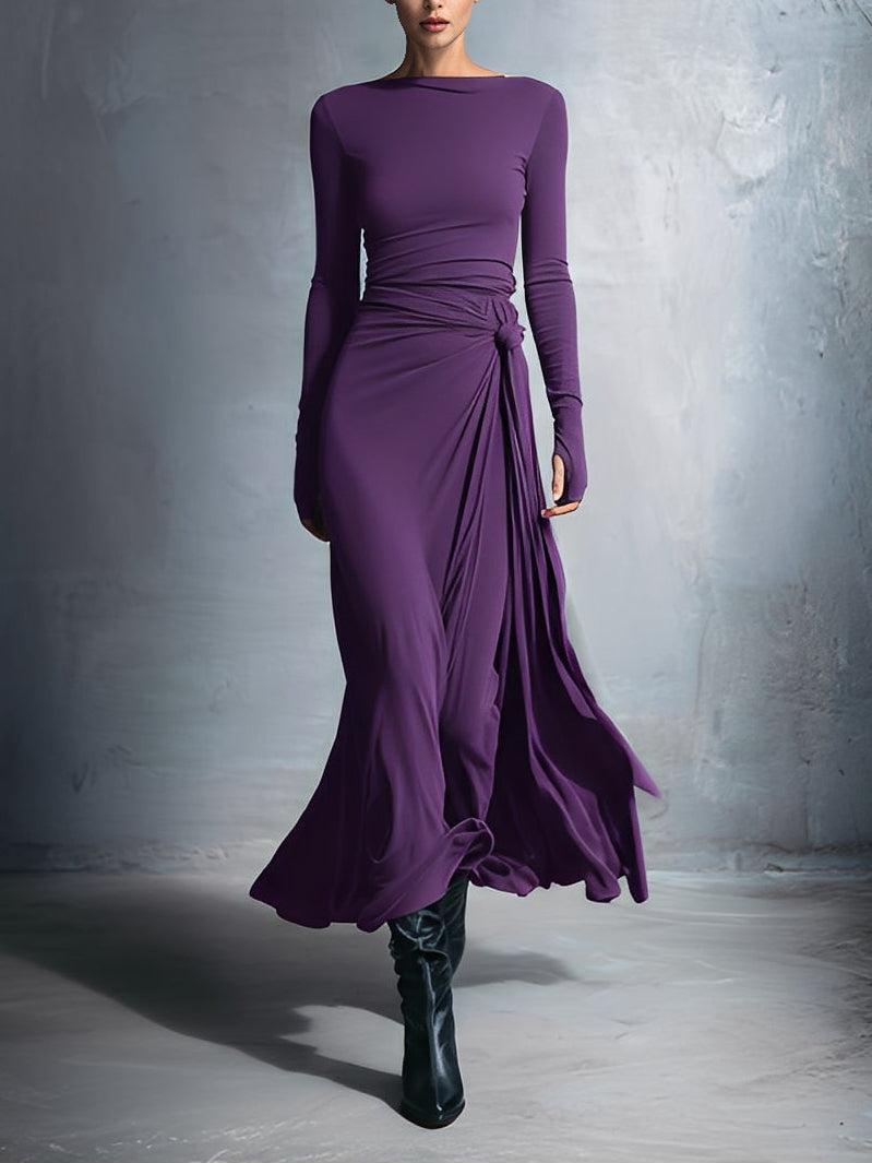 Woman wearing a long-sleeve maxi dress with an adjustable side tie
