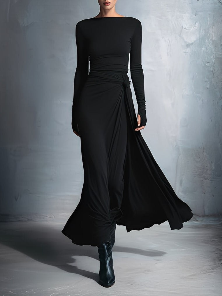Woman wearing a long-sleeve maxi dress with an adjustable side tie