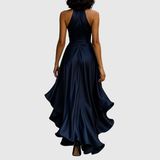 Woman wearing an evening wrap maxi dress with high slit