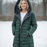 Woman wearing a fleece-lined quilted padded jacket with a shaped waist