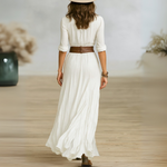 Woman wearing a button-front boho maxi dress with belt