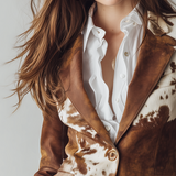 Woman wearing a vintage cow print blazer