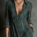 Woman wearing a full-length green plaid shirt dress with long sleeves