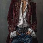 Woman wearing a long embroidered velvet jacket