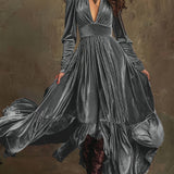 Woman wearing a deep V-neck pleated maxi dress