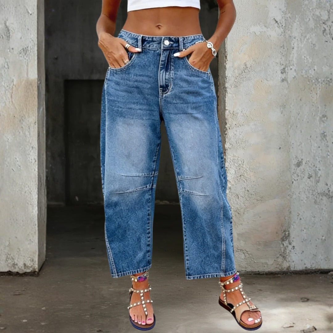 Woman wearing loose flare denim jeans with a flattering high-rise fit
