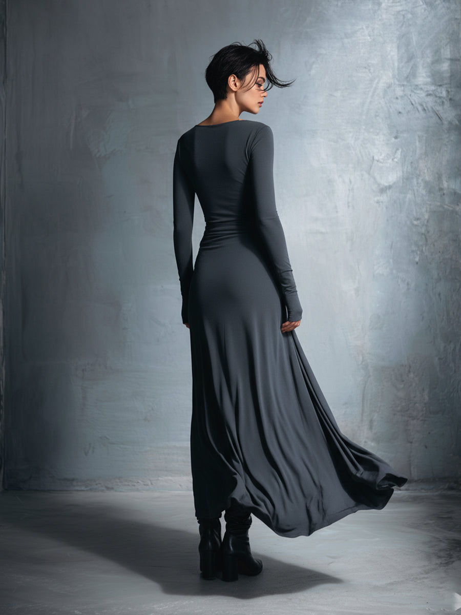 Woman wearing a long-sleeve maxi dress with an adjustable side tie